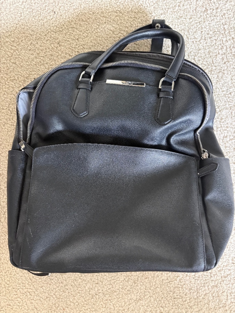 TUMI LEATHER BACKPACK